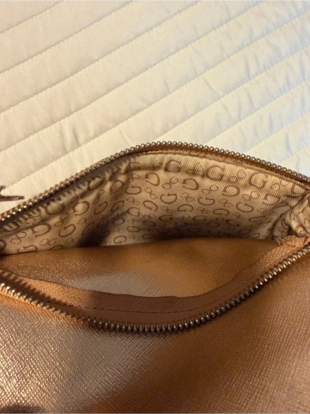 GUESS Metallic Gold Logo Backpack with Flower Charm